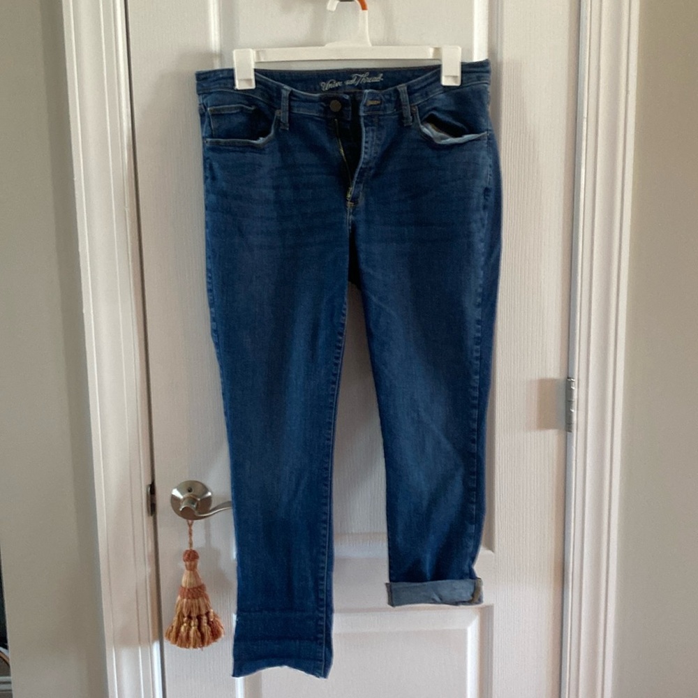 Universal thread size 18/34L blue jeans bottom frayed but rolled up.